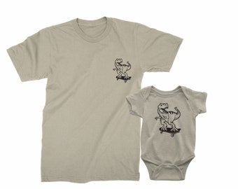 Father & Son matching t-shirts. Father's Day gift for Father and Baby. Matching Trex Dinosaurs riding skateboards. Father Son matching tees.