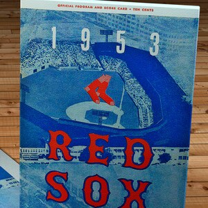 May include: A vintage 1953 Red Sox programme from Fenway Park. The programme features a blue and white illustration of the baseball field with the team's name in red letters.