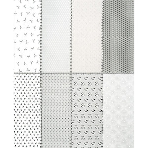 May include: A fabric swatch featuring eight different patterns in shades of white and gray. The patterns include floral, geometric, and dotted designs. The fabric is likely cotton or a similar material, suitable for quilting or crafting projects.