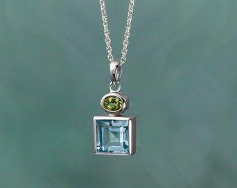 ALARRI 5.5 Carat 14K Solid White Gold Tomorrow We Live Blue Topaz Necklace with 20 Inch Chain Length ALARRI 5.5 Carat 14K Solid White Gold Tomorrow We Live Blue Topaz Necklace with 20 Inch Chain Length