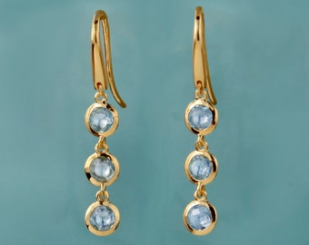 gold and blue topaz triple stone drop earrings