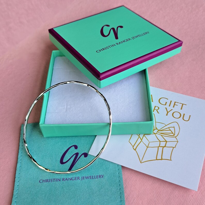 Sterling silver hoola hoop bangle in Christin Ranger Jewellery gift packaging and card