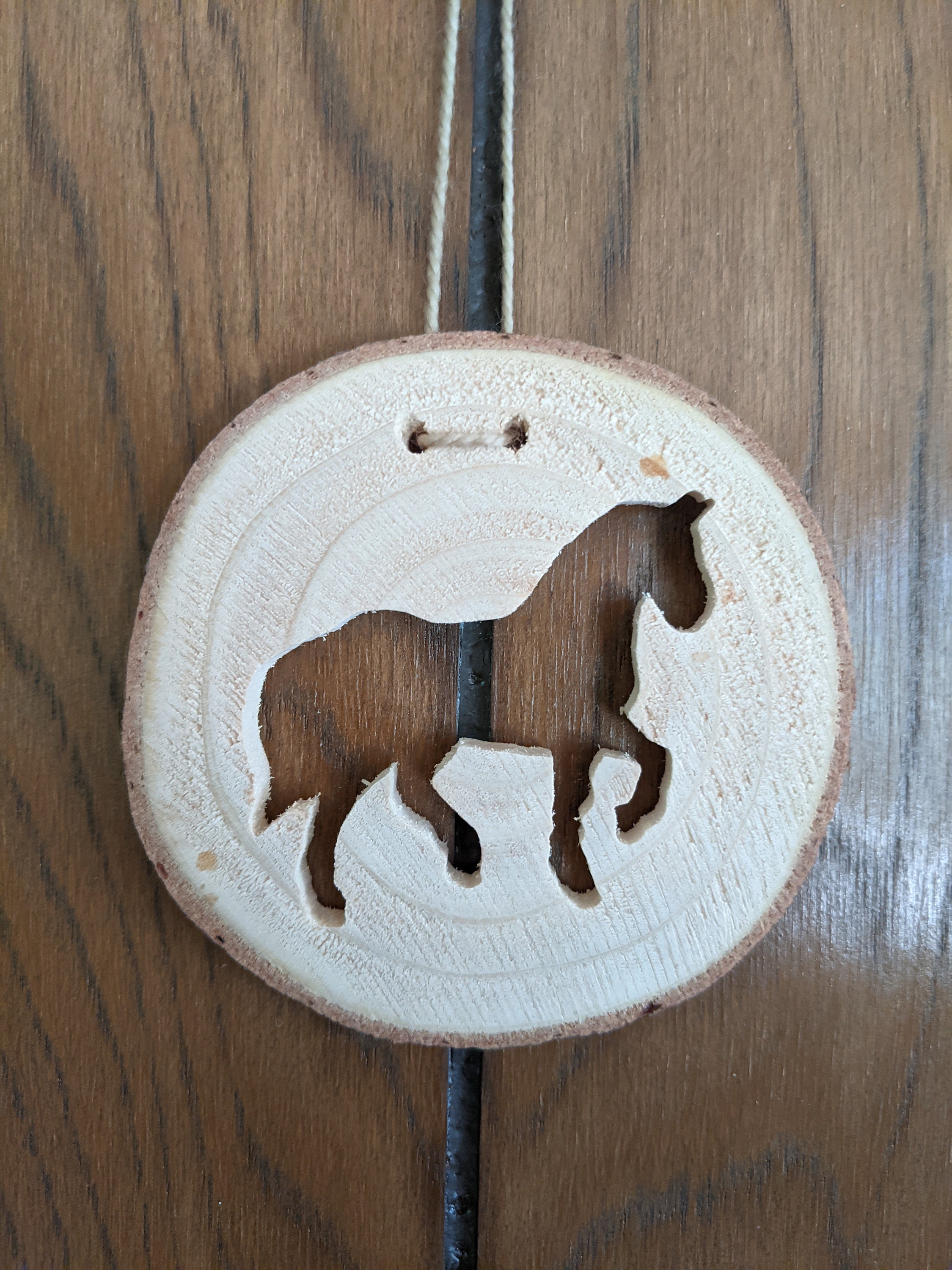 Wooden horse ornament carved from last year's Oregongrown Etsy