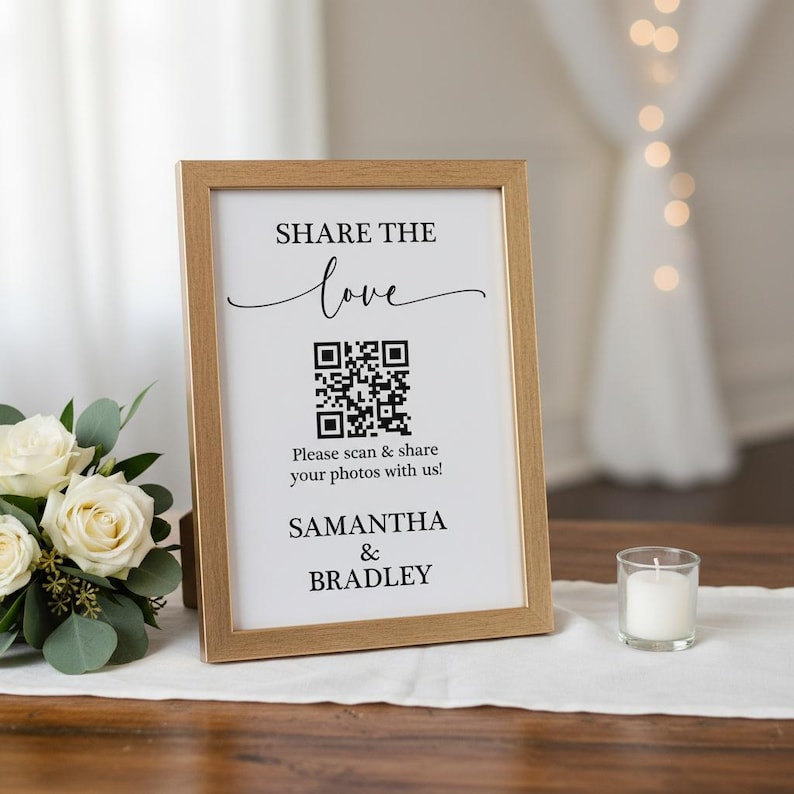 May include: A framed sign with the text "SHARE THE love" and a QR code. Below the QR code is the text "Please scan & share your photos with us!" and the names "SAMANTHA & BRADLEY". A small candle sits to the right.