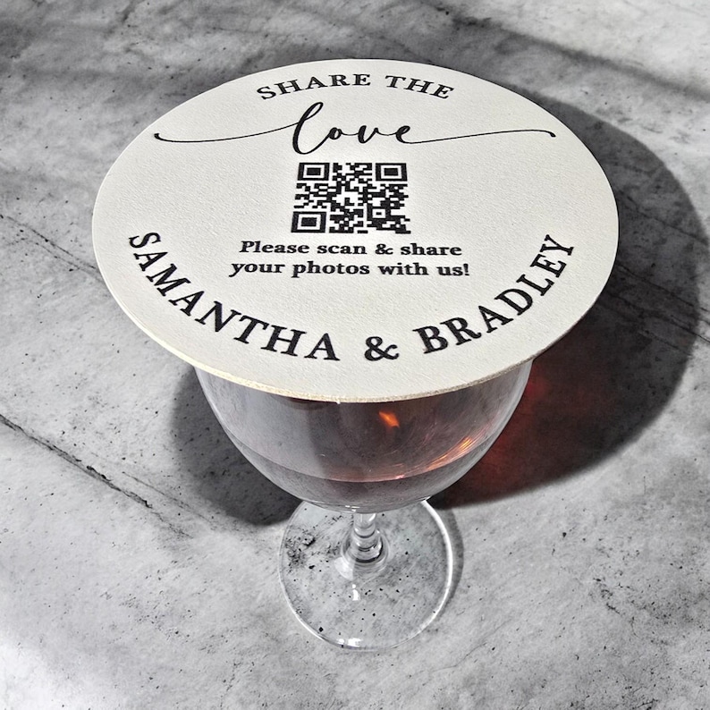 May include: A white round coaster with the text "SHARE THE love" and a QR code. Below the QR code is the text "Please scan & share your photos with us!" and the names "SAMANTHA & BRADLEY".