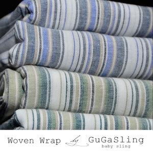 May include: A stack of woven baby slings in white, blue, and green stripes. The slings are folded and stacked on top of each other. The text "Woven Wrap by GuGaSling baby sling" is printed on the bottom of the image.