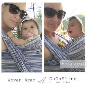 May include: A woman wearing sunglasses is carrying a baby in a blue and white striped woven wrap sling. The baby is wearing a light blue sun hat and a pacifier. The text "Heaven" is visible on the sling. The text "Woven Wrap by GuGaSling baby sling" is visible below the image.