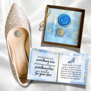 May include: A bridal flat shoe with rhinestone embellishments, a sixpence coin, and a gift box with a blue wax seal. A card reads "Something Old, Something New, Something Borrowed, Something Blue & A Sixpence for Your Shoe."