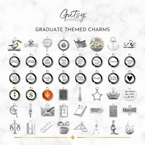 May include: A collection of silver charm pendants with various graduation-themed designs, including a graduation cap, a hot air balloon, a compass, a US flag, a heart, an anchor, a crown, a microscope, a ruler, a protractor, a compass, an apple, a book, a keyboard, a calculator, a graduation scroll, a mortarboard, a diploma, a semicolon, a dollar sign, a heart, a star, a microphone, a crescent moon, a pen, an envelope, a scale, a graduation year, and the word "FRIENDS".