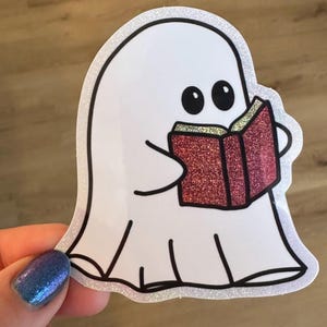 Cute Ghost Reading Book Sticker – Glossy Vinyl with Glitter Effect – Halloween, Book Lover, Spooky, Aesthetic Sticker - Laptop, Water Bottle