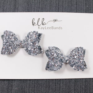 Silver pigtail bows. Silver hairbows. Glitter hairbows. Pigtail bow set. Pigtail hairbows. Glitter bows. Hair clip barrette.