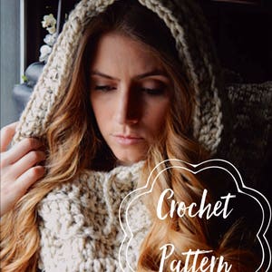 May include: A close-up of a woman wearing a white crocheted hooded cowl. The cowl is made with a chunky yarn and has a simple stitch pattern. The text "Crochet Pattern" is superimposed on the image.