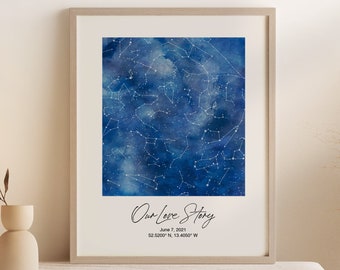 May include: A watercolor print of a night sky with stars and constellations. The print has the text "Our Love Story" with the date "June 7, 2021" and coordinates "32.5009° N, 13.4007° W".