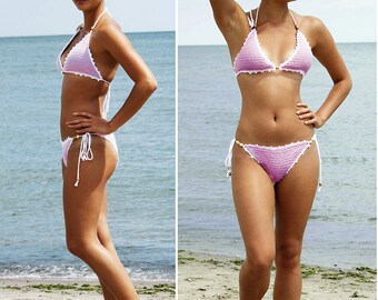 May include: A pink and white crochet bikini with a halter top and a low-rise bottom. The bikini is decorated with small white beads.