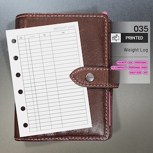 May include: A brown leather Filofax planner with a weight log insert. The planner has a snap closure and pink stitching. The weight log insert is white with black lines and the text "WEIGHT LOG". The image also includes the text "035 PRINTED Weight Log".