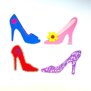 May include: Four paper cutouts of high-heeled shoes in different colors and designs. The shoes are pink, blue, red, and purple. The pink shoe has a yellow flower embellishment. The blue shoe has a pink flower embellishment. The red shoe has a purple swirl design. The purple shoe has a white floral pattern.
