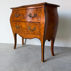 May include: A set of three ceramic mugs with a speckled, matte finish. The mugs are in shades of cream, light gray, and dark gray. Each mug has a simple, minimalist design, perfect for coffee or tea.