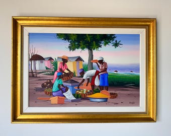 May include: A framed painting depicts a market scene with several figures interacting near baskets of produce. The artwork features a gold frame, a tree, and colorful buildings in the background. The scene is set outdoors with a vibrant sky.