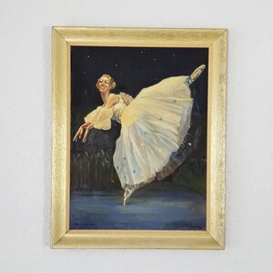 May include: A framed painting of a ballerina in a white tutu, dancing against a dark blue background with stars. The ballerina is in mid-air, with her leg extended and her arms outstretched.