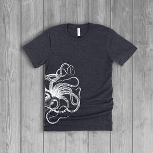 A dark gray women's short-sleeve t-shirt with a white side octopus with tentacles print on the front.