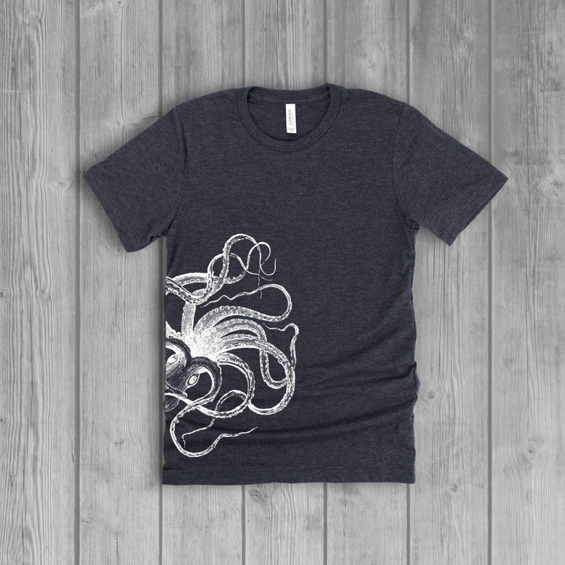 A dark gray women's short-sleeve t-shirt with a white side octopus with tentacles print on the front.