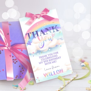 May include: Rainbow-themed thank you tag with a pink bow, featuring a rainbow, clouds, and hearts. The text reads "Thank You" and "Thank you for celebrating my 9th birthday with me! Love from Willoh."