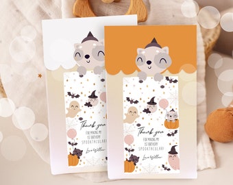 May include: Two Halloween-themed thank you cards. Each card features a smiling raccoon wearing a witch hat. The cards have a white and orange background with illustrations of ghosts, bats, pumpkins, and the text "Thank you for making my 1st birthday Spooktacular! Love Willow."