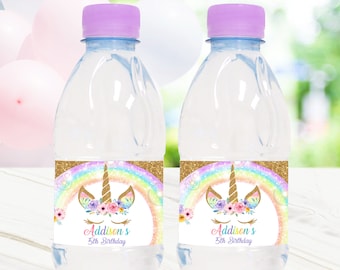 May include: Two clear water bottles with purple caps. Each bottle has a label featuring a unicorn design with a rainbow, flowers, and the text "Addison's 5th Birthday."