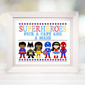 May include: A white framed sign with a blue background and the text "SUPERHEROES PICK A CAPE AND A MASK".  There are six cartoon superheroes on the sign: Superman, Batman, Wonder Woman, Captain America, and Spiderman.
