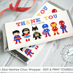 May include: Printable 1.55 oz Hershey chocolate bar wrapper featuring a superhero theme. The wrapper is white with a red, blue, and yellow "Thank You" message. It includes illustrations of Superman, Wonder Woman, Batman, Captain America, Iron Man, and Spiderman. The text "From Harvey" is included below the "Thank You" message.