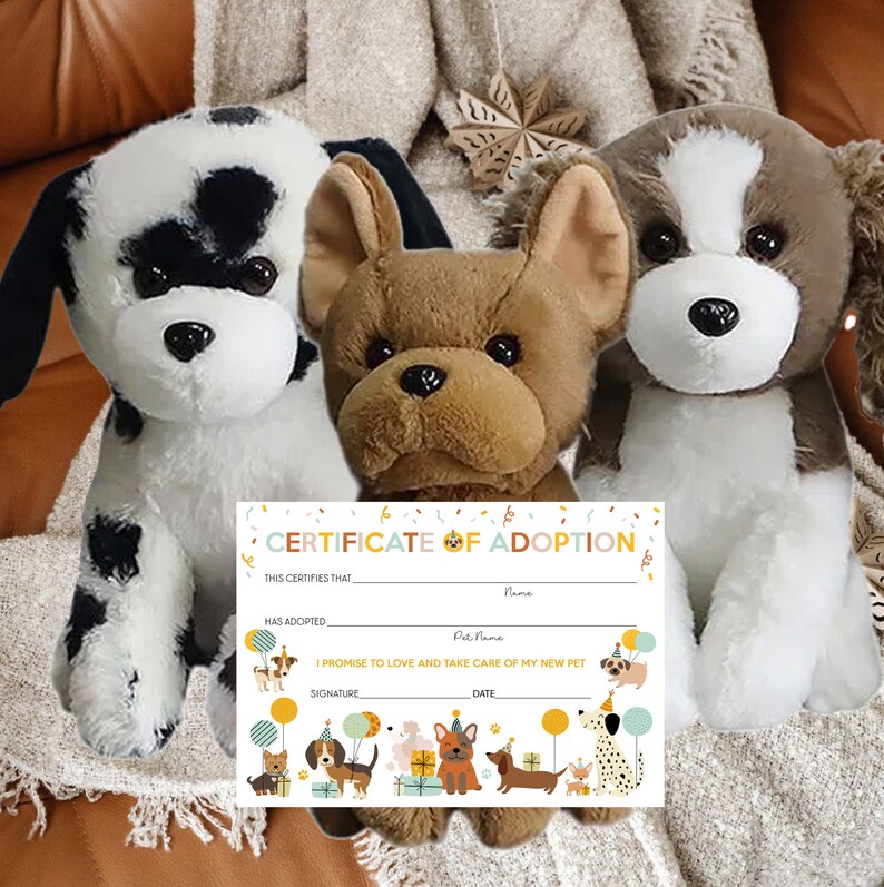 May include: A certificate of adoption for a new pet, with a black and white dog, a brown and white dog, and a brown and white French bulldog plush toy. The certificate has a colorful border with cartoon dogs and the text "CERTIFICATE OF ADOPTION".