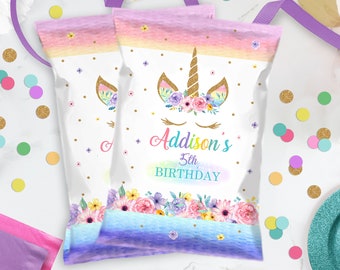 May include: Two purple and pink unicorn-themed treat bags with a gold unicorn head, flowers, and the text "Addison's 5th Birthday".