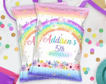 May include: Two purple and white treat bags with a rainbow, glitter, and floral design. The text on the bag reads "Addison's 5th Birthday".