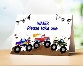 May include: A white card with the text "WATER Please take one" in blue. Three cartoon monster trucks are driving through mud. The trucks are red, blue, and green.