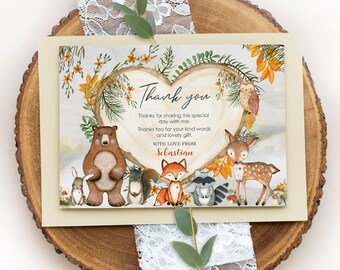 May include: A cream-coloured thank you card with a woodland theme. The card features a heart-shaped design with a bear, fox, deer, and other forest animals. The text reads "Thank you" and "With love from Sebastian."