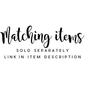 May include: Text graphic that reads "Matching items" in black cursive font. Below the text is "Sold separately" and "Link in item description" in black sans-serif font.