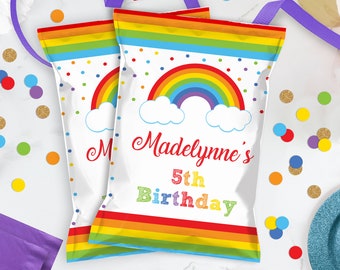 May include: Two white treat bags with a rainbow, clouds, and polka dots. The text on the bag reads "Madelynne's 5th Birthday".