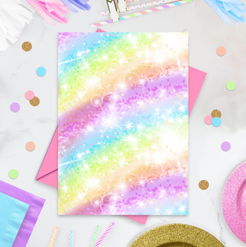 May include: A rainbow-coloured card with a glittery background and white stars. The card is ideal for a birthday party or other special occasion.