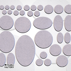 May include: A set of 20 gray, textured, round and oval-shaped stickers. The stickers are various sizes and are perfect for adding a unique touch to crafts, planners, and more.
