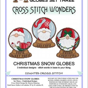 May include: Three counted cross stitch patterns for Christmas snow globes. Each pattern features a gnome with a different festive message: "Home Sweet Home", "Welcome", and "Merry Christmas".