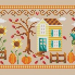 May include: A cross-stitch pattern depicting an autumnal scene with a house, a truck filled with pumpkins, a scarecrow, and sunflowers. The pattern is in shades of orange, yellow, green, and brown.