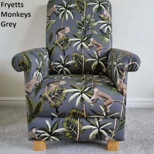 May include: Grey upholstered armchair featuring a pattern of monkeys, palm trees, and tropical foliage. The chair has curved armrests and wooden legs. The text "Fryetts Monkeys Grey" is visible on the left side.