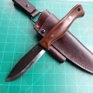 Campcraft knife in CPM3v tool steel with dark brown canvas micarta scales and custom leather sheath