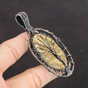 #CopperWireWrappedJewelry
#WireWrappedPendant
#CopperPendant
#TreeOfLifePendant
#CopperWirePendant	
#HandmadeCopperJewelry	
#WrappingGemstone
#CopperWireJewelry
#DesignerPendant
#UniqueCopperDesign
#Pendant
#Jewelry
#WireWrap
#WirePendant
#Wrapped