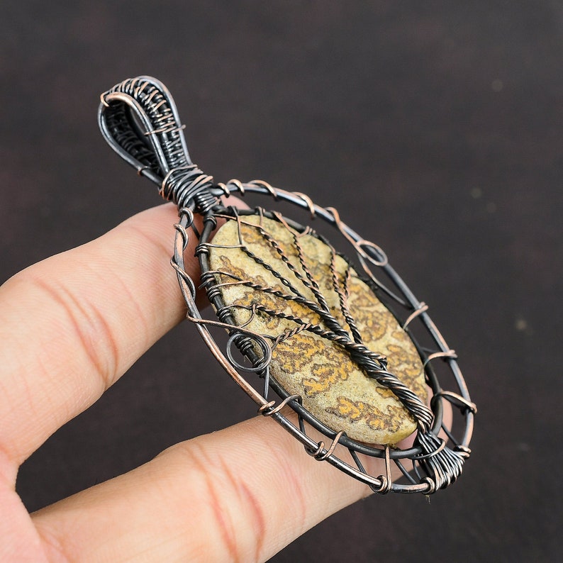 #CopperWireWrappedJewelry
#WireWrappedPendant
#CopperPendant
#TreeOfLifePendant
#CopperWirePendant	
#HandmadeCopperJewelry	
#WrappingGemstone
#CopperWireJewelry
#DesignerPendant
#UniqueCopperDesign
#Pendant
#Jewelry
#WireWrap
#WirePendant
#Wrapped