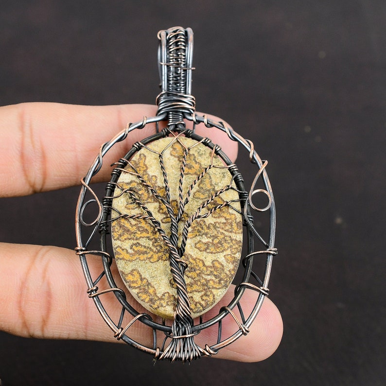 #CopperWireWrappedJewelry
#WireWrappedPendant
#CopperPendant
#TreeOfLifePendant
#CopperWirePendant	
#HandmadeCopperJewelry	
#WrappingGemstone
#CopperWireJewelry
#DesignerPendant
#UniqueCopperDesign
#Pendant
#Jewelry
#WireWrap
#WirePendant
#Wrapped