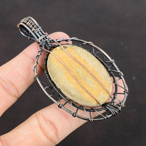 #CopperWireWrappedJewelry
#WireWrappedPendant
#CopperPendant
#TreeOfLifePendant
#CopperWirePendant	
#HandmadeCopperJewelry	
#WrappingGemstone
#CopperWireJewelry
#DesignerPendant
#UniqueCopperDesign
#Pendant
#Jewelry
#WireWrap
#WirePendant
#Wrapped