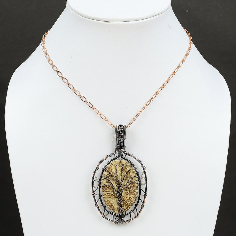 #CopperWireWrappedJewelry
#WireWrappedPendant
#CopperPendant
#TreeOfLifePendant
#CopperWirePendant	
#HandmadeCopperJewelry	
#WrappingGemstone
#CopperWireJewelry
#DesignerPendant
#UniqueCopperDesign
#Pendant
#Jewelry
#WireWrap
#WirePendant
#Wrapped