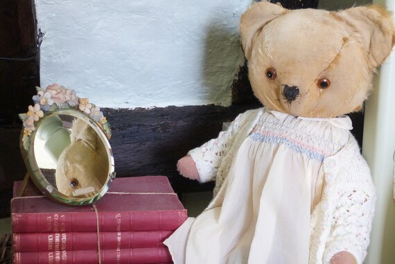 large tatty teddy bear