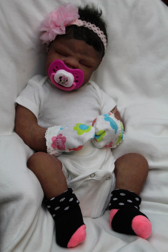 black full body silicone baby
